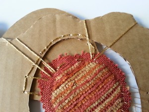 Cardboard, fabric and metallic thread