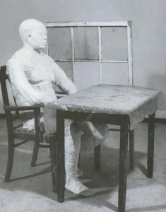 George Segal - Man sitting at a table