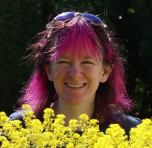 Debbie in the garden with her woad plants