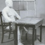 man sitting at a table - George Segal
